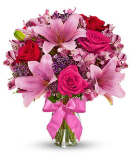 Red roses and pink lilies in a celebration bouquet for San Francisco