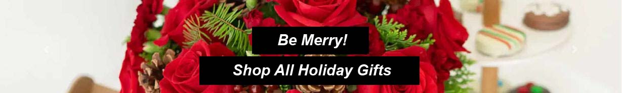 Assortment of Christmas gift baskets filled with gourmet snacks, fruit and holiday treats