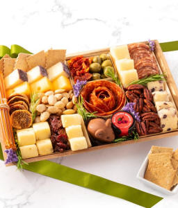 A deluxe meat and cheese charcuterie board on a platter