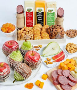 Sweet and savory snack basket with chocolate dipped fruit, cheeses, nuts, and sausage.
