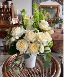 A bouquet of white roses in a vase