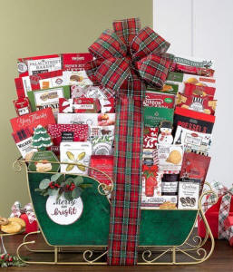 Christmas sleigh gift basket arranged in a decorative sleigh with gourmet treats