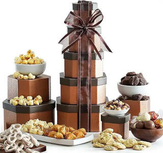 Chocolate and snack gift tower with stacked boxes filled with gourmet sweets and treats