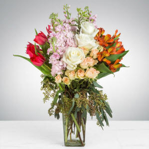 A vase filled with long, tall stemmed flowers