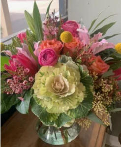A bouquet of mixed summer flowers in vibrant colors