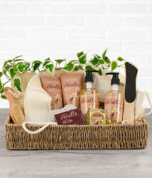 A gift basket filled with bath, body and spa lotions foir mom