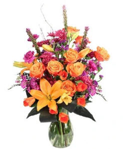 A mix of amber colored lilies and roses