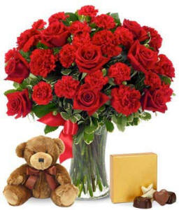 roses teddy bear and chocolate in a flower bouquet love gift